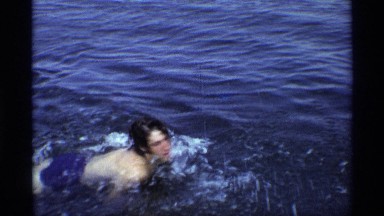 1971: the people swim in the sea with happiness NEW YORK