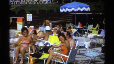1971: people gathered together outside sitting and socializing NEW YORK