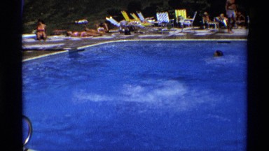 1971: boy dives into public pool, swims to edge then climbs out and gets cold