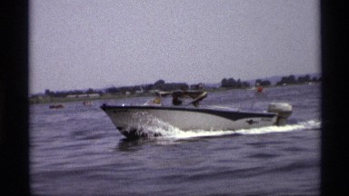 1971: a boat traveled on the water at the river and some nature