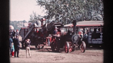 1969: a slowly run the tractor in the road side huge people watch