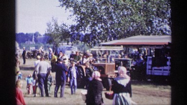 1969: farmers people were gathered in a place and enjoying their harvesting
