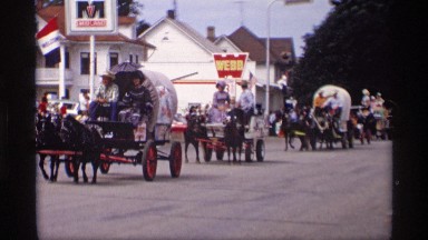 1969: a line of many horse cart are walk one by one like a army parade