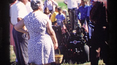 1969: at the open ground a lay and some people watching a machine