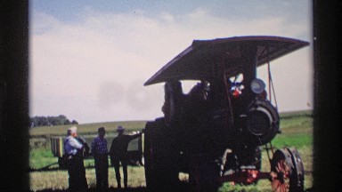 1969: people watching and repairing the train vehicle around the forest MABEL
