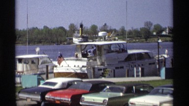 1969: the ship and car are park behind the sea and to take this movement to lay