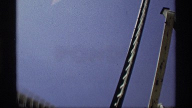 1969: large windmill rotating its blades on a sunny day