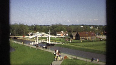1969: people walk along sidewalks in the cool weather