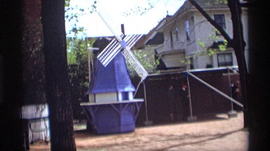 1969: a small windmill near to a building with two stairs HOLLAND MICHIGAN