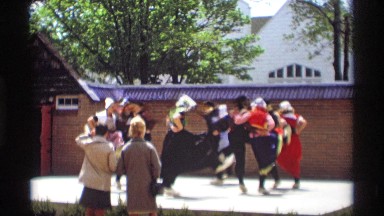 1969: peoples are dancing around the public place and middle of building HOLLAND
