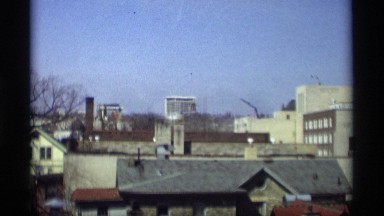 1966: some buildings are nearly placed and trees also there it looks like a city