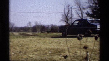 1966: a car run on the grass land and turn the car to the right side