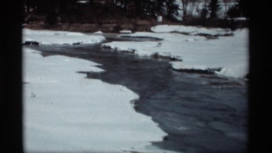 1966: snow landscape where water divides two edges of the land of snow