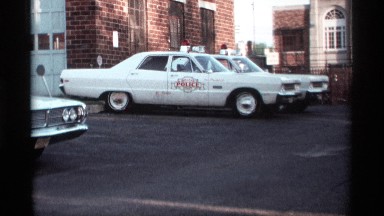 1969: a car parking place stop the three car near to building come to tree