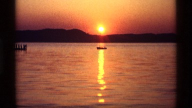 1969: boats in the water as the sun is rising. HOLLAND MICHIGAN