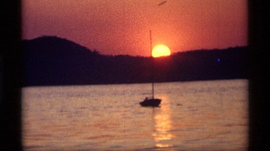 1969: taking a trip in the sea while sunset is dawning on it HOLLAND MICHIGAN