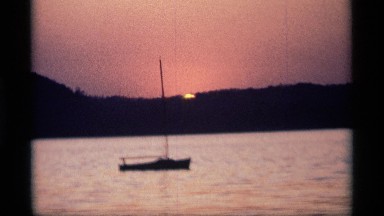 1969: one board move in the river evening time sun shine set that boat