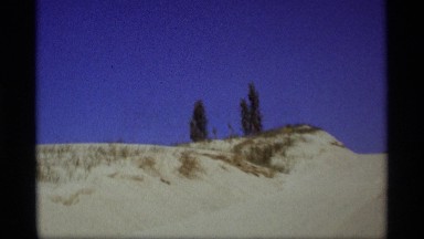 1969: the car is traveled on the sand road it's had many up and down the driver