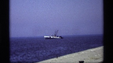 1969: a ship or boat sail on the sea its surrounding huge amount of the salt