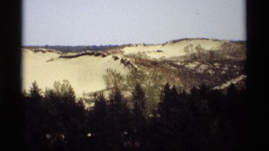 1969: deserted area filled with short plants and sandy place