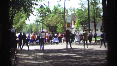 1969: group of loggers dance in street while wearing traditional outfits HOLLAND