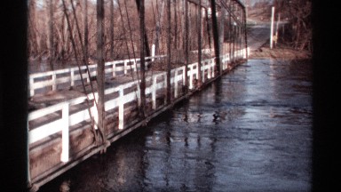 1969: overpass, over running water, within wooded region. ROCKFORD MINNESOTA