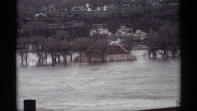1969: flood is surround the building full of water, vintage clip