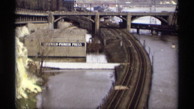1969: railway track to got to river near in place the river center big bridge