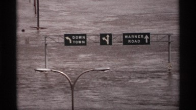 1969: the road come the flood in heavy so board sign in off steel pipe