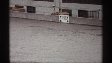 1969: a sign shows the crest of a river on the previous year in a canal