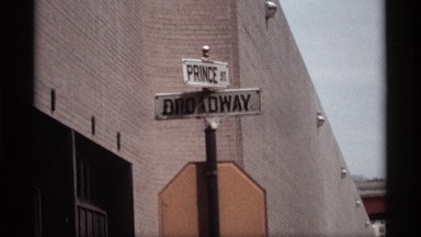 1969: name board white and black letter,steel back big wall another side