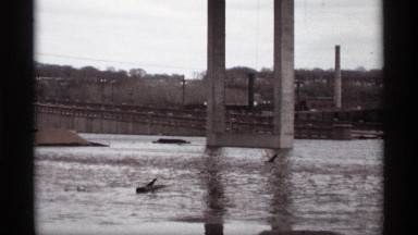 1969: water flows under an industrial bridge SAINT PAUL MINNESOTA