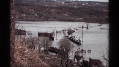1969: a big river go to the water heavy in the place morning time near green