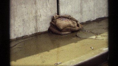 1969: the water is came out from wall gap and someone try to stop the water