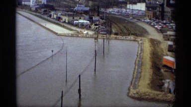 1969: a big river near to road parking the lorry top angle view fast going water
