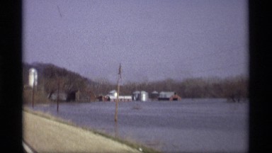 1969: a riverside travel by a car,looking the nature,looks awesome