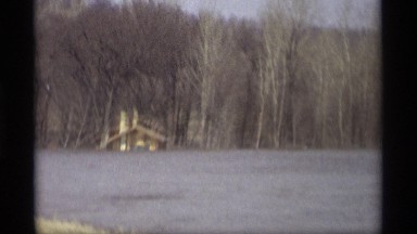 1969: slow drive the car view of the near rivercenter place one house back trees