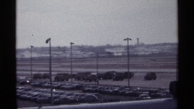 1968: commercial plane that just landed on a airplane landing strip at an