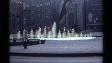 1968: a fountain and a guy walking near to the place without any excitement may
