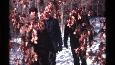 1968: group of people walking in nature on a snowy day CHICAGO ILLINOIS
