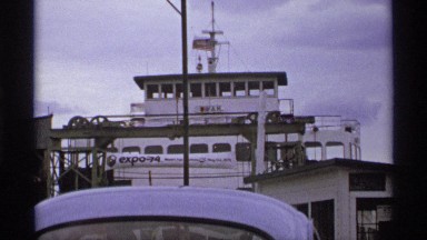 1974: a building that located alone and a flag at the rooftop and it looks like