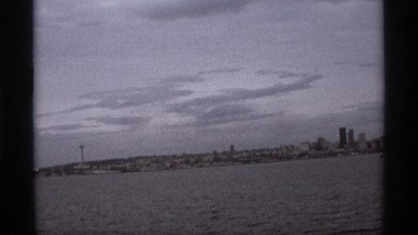 1974: a view from a boat looking over the city with its skyscrapers in the