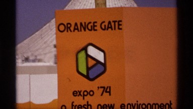 1974: orange sign stating "expo '74 a fresh new environment." SPOKANE