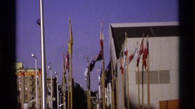 1974: more different types of flags are at the place and it looks the industrial