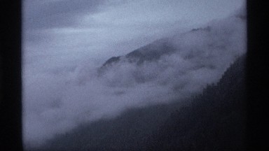 1974: evening time cloudy mountain scene with blue sky and distant horizon
