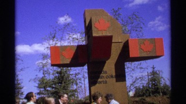 1974: a design of a board that has some information people are watching the