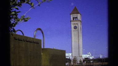 1974: a bell tower rising above the landscape on a sunny day WORLDS FAIR SEATTLE