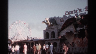 1974: people enjoying themselves on a nice day in a castle-themed theme park