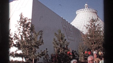 1974: a crowd walk past a monument in the sunshine WORLDS FAIR SEATTLE