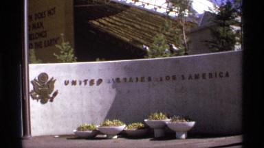 1974: a board with the name of the country and some things may be nuts are at